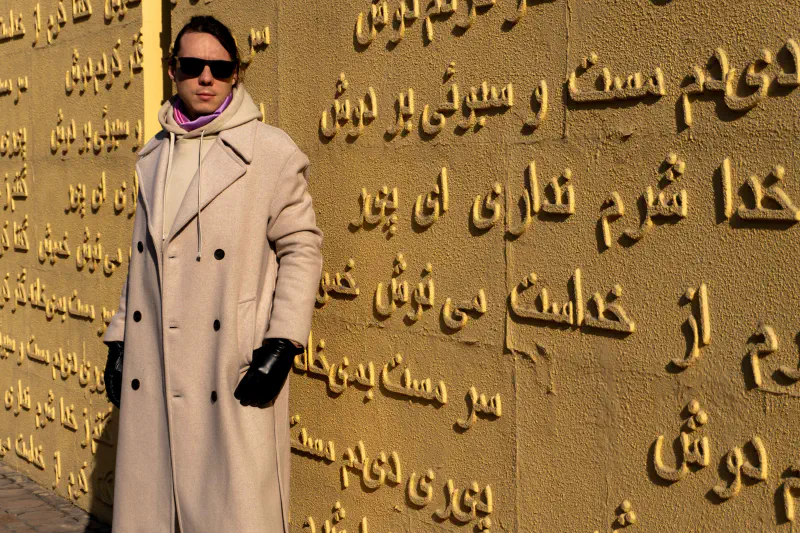 Man and sand wall, Almaty, Kazakhstan